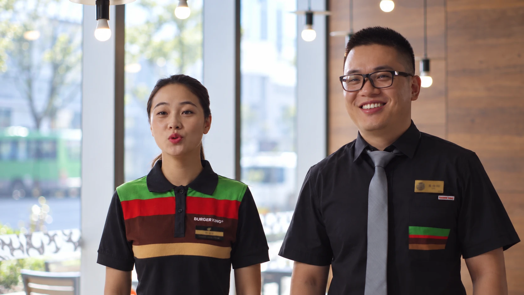 Two restaurant colleagues speaking together in an interview.