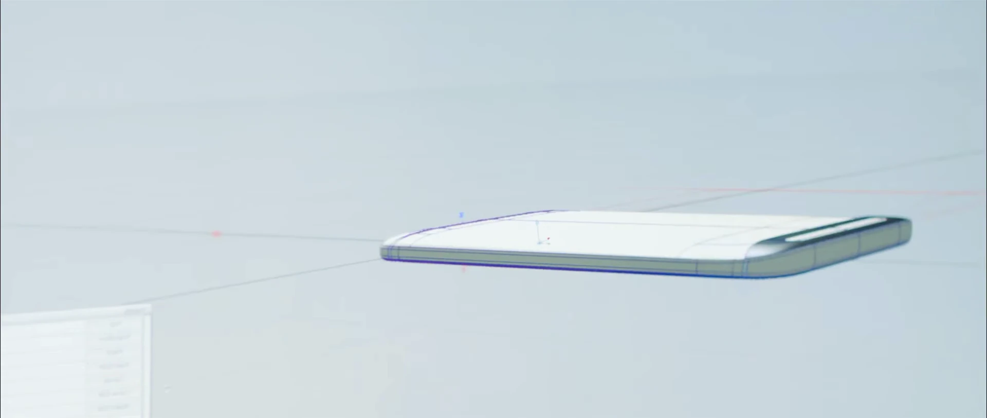 A slim smartphone resting on a pale display surface.