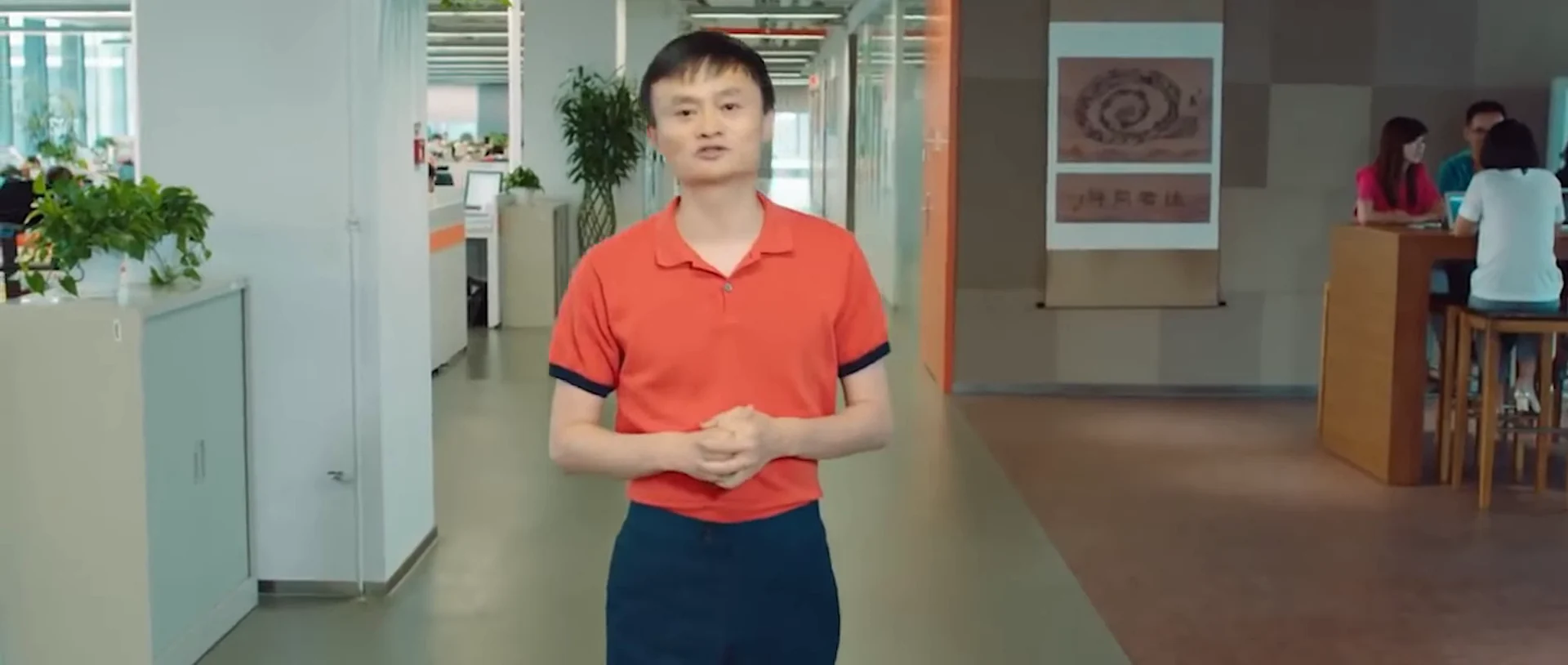 Jack Ma speaking inside an open-plan Alibaba office.