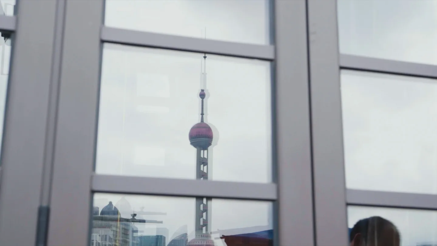 Shanghai streetscape reflected in the flagship facade