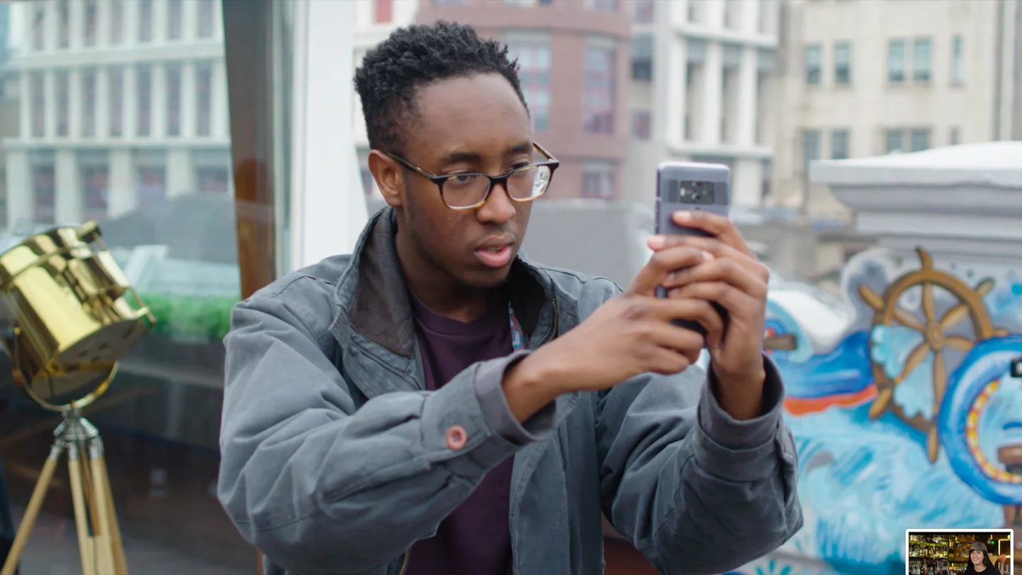 Participant composing a photograph on a Huawei smartphone
