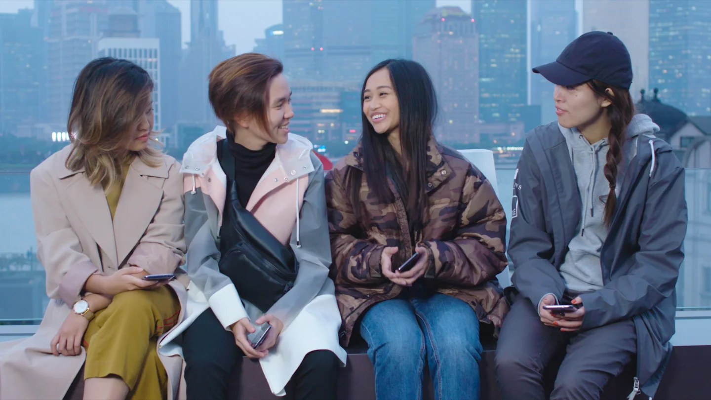 Four participants talking on a Shanghai rooftop