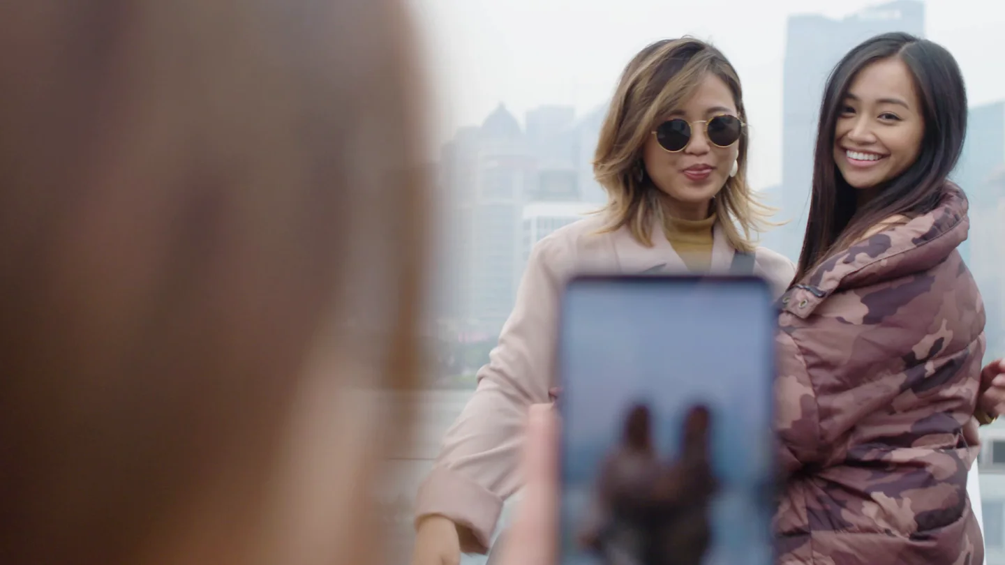 Two participants posing for a portrait on a Shanghai rooftop