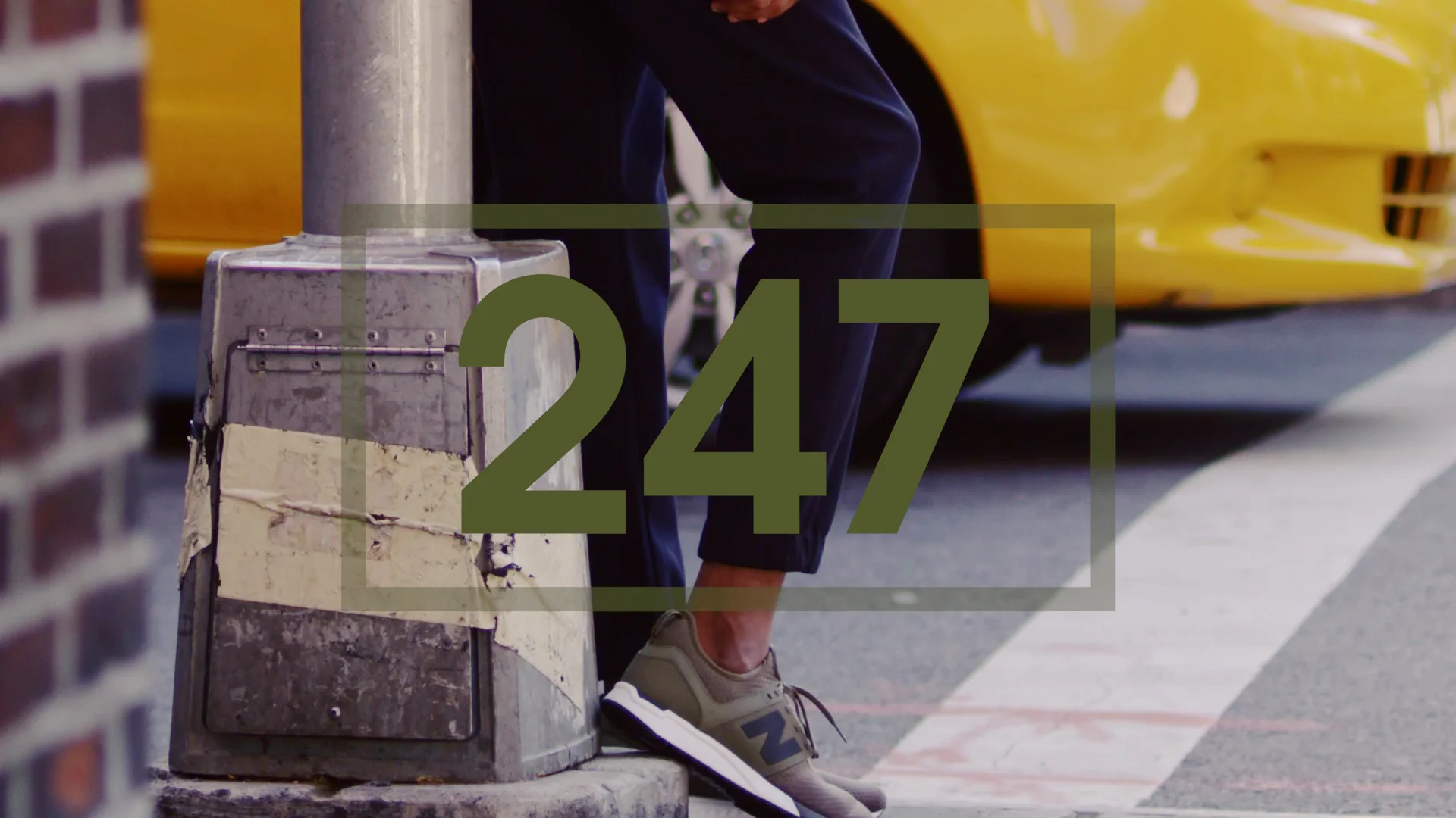New Balance 247 footwear beside a Shanghai street and yellow car