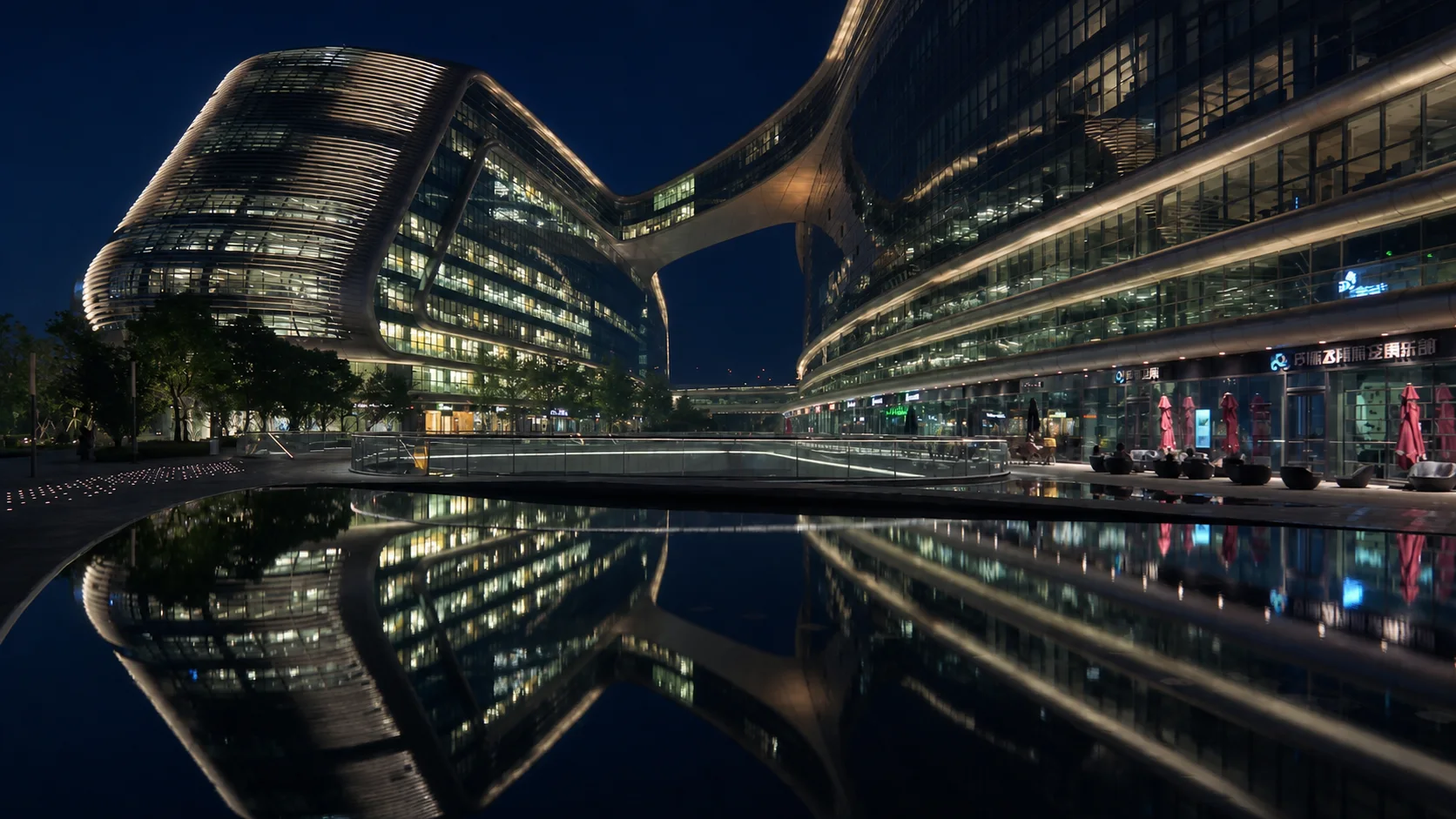 Sky Soho reflected in still water at night in Shanghai