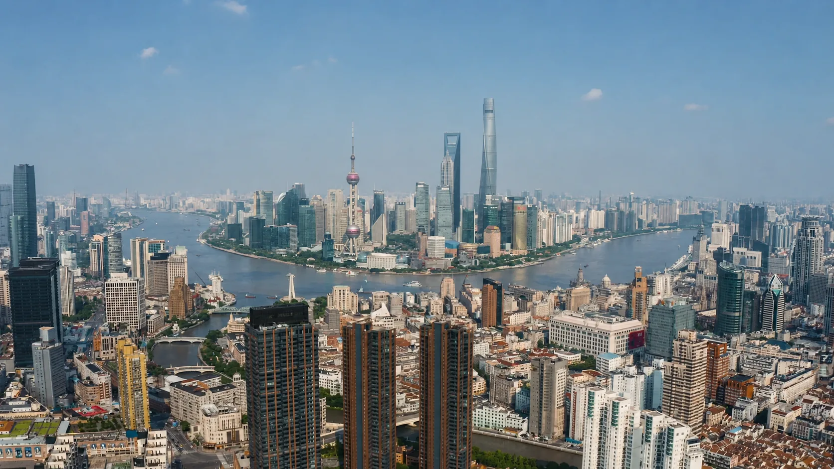 High panoramic view across Shanghai buildings and the winding river