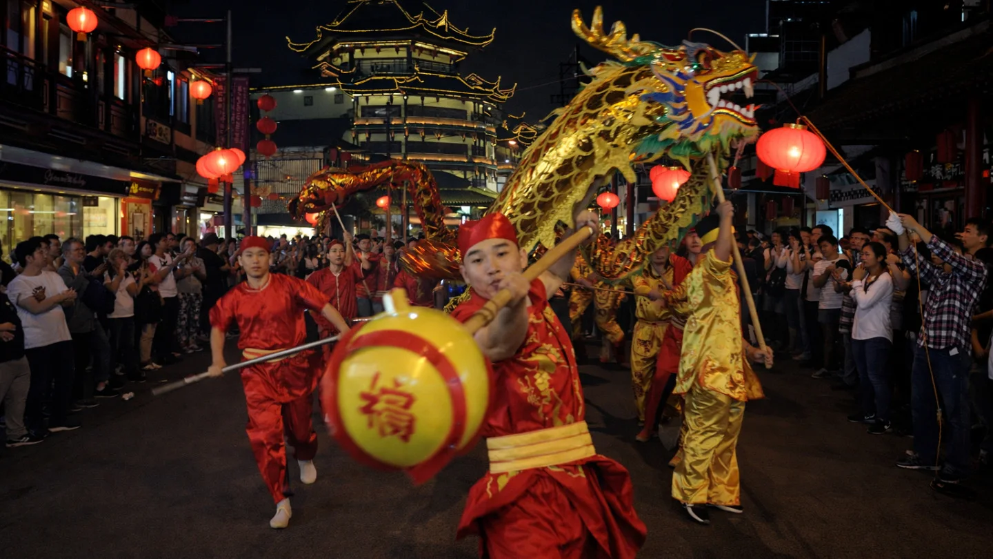 Dragon dancers performing near Yu Garden in Shanghai at night