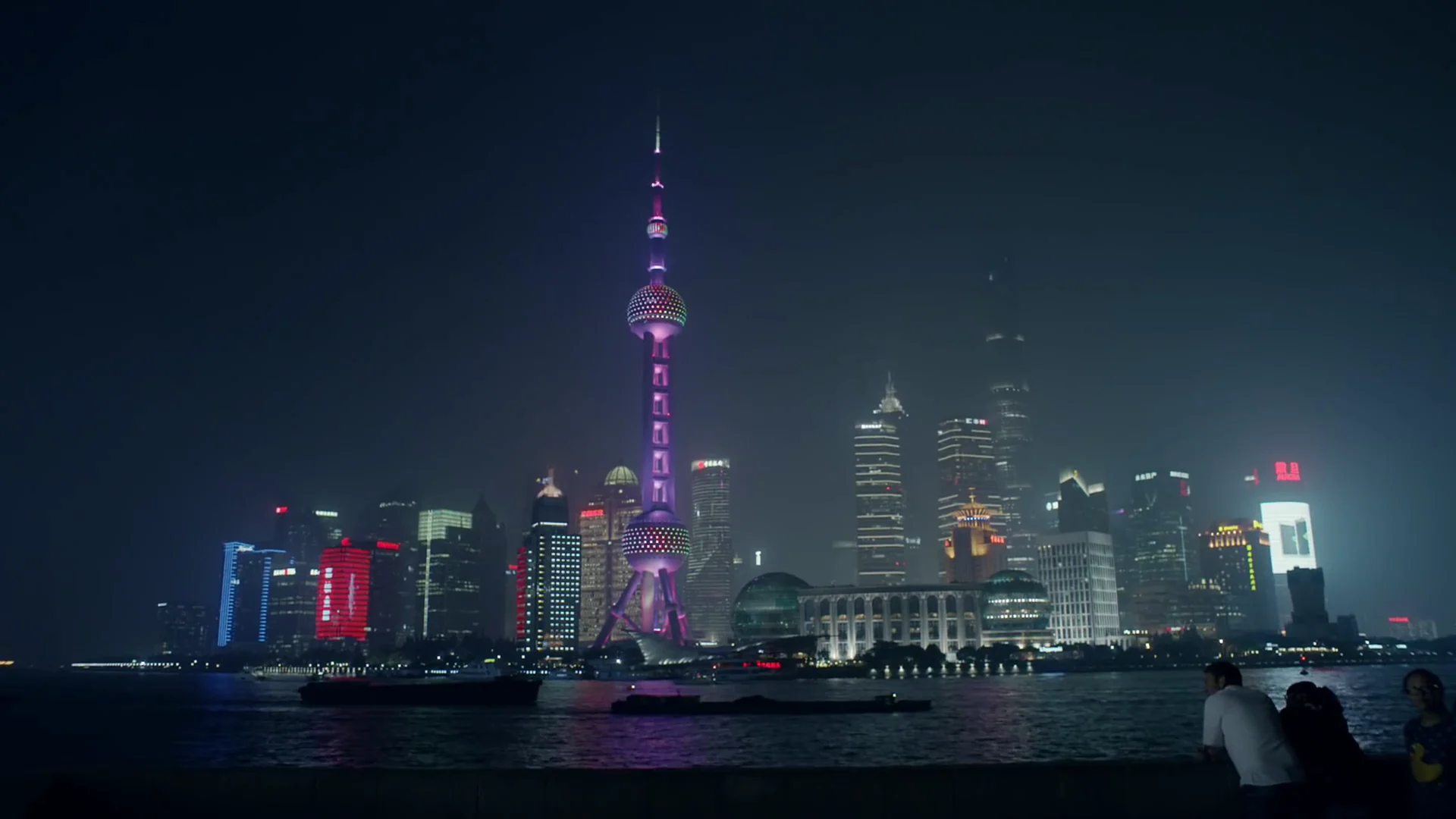 Shanghai skyline illuminated across the Huangpu River at night