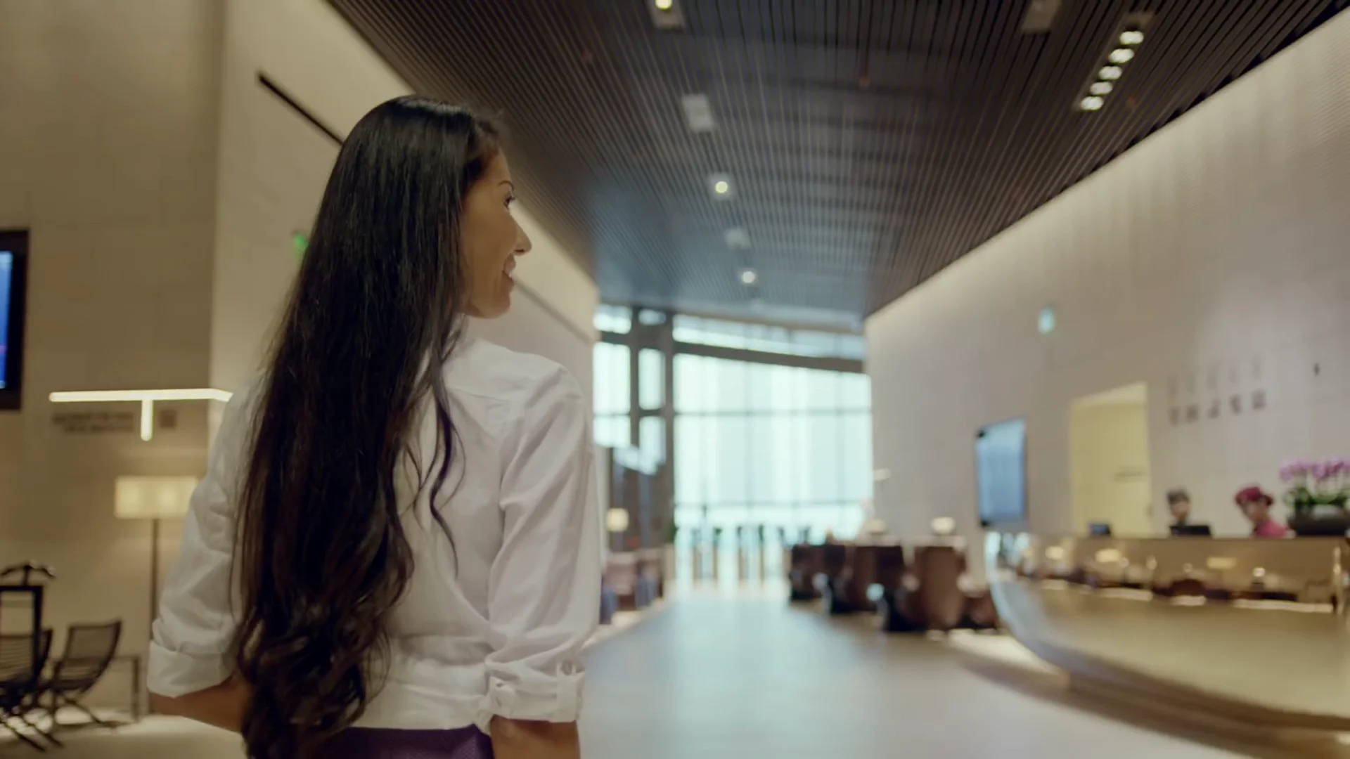 Traveller walking through a bright airport lobby