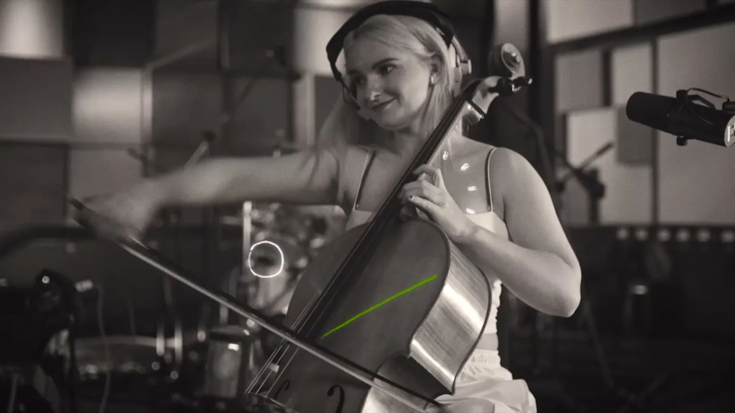 A Clean Bandit musician plays strings during the Beijing studio filming
