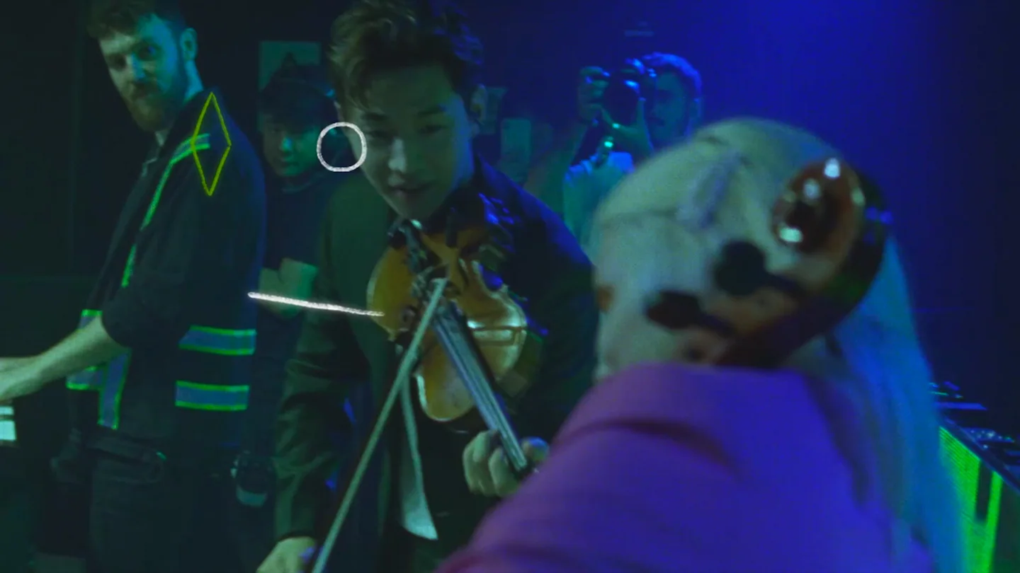 Henry Lau plays violin during the fan-experience performance