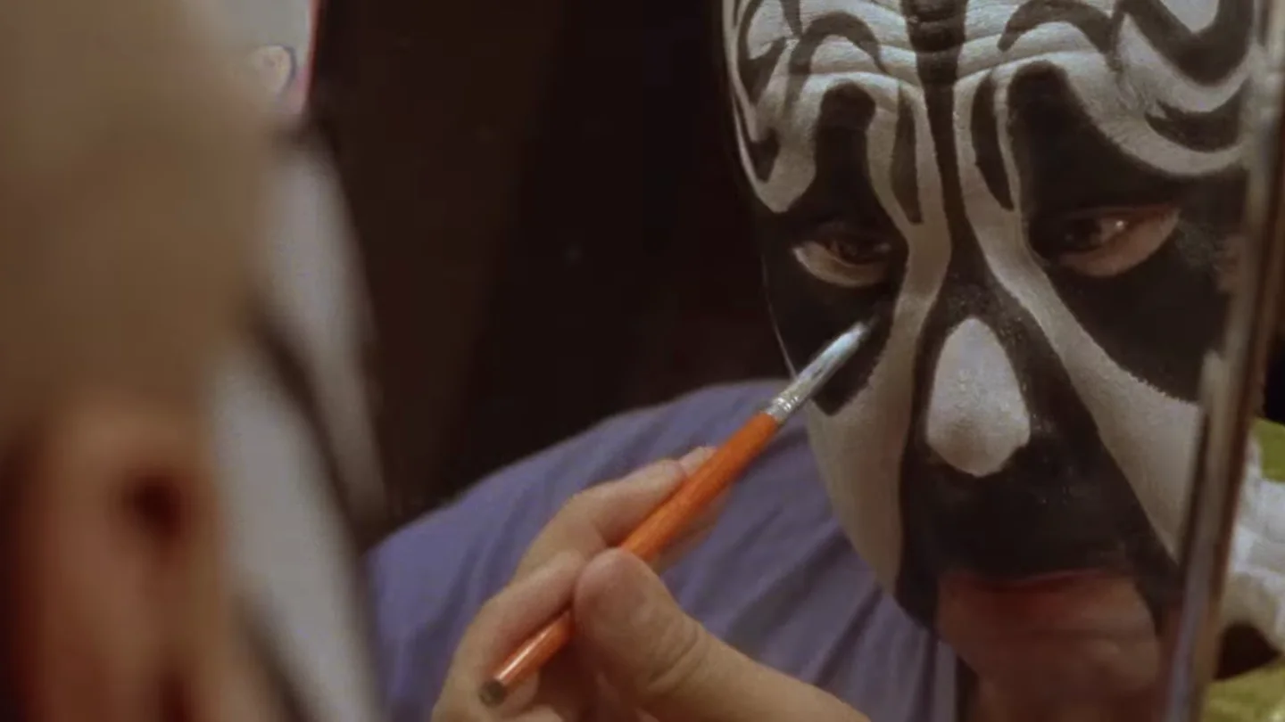 Beijing opera makeup is applied before filming