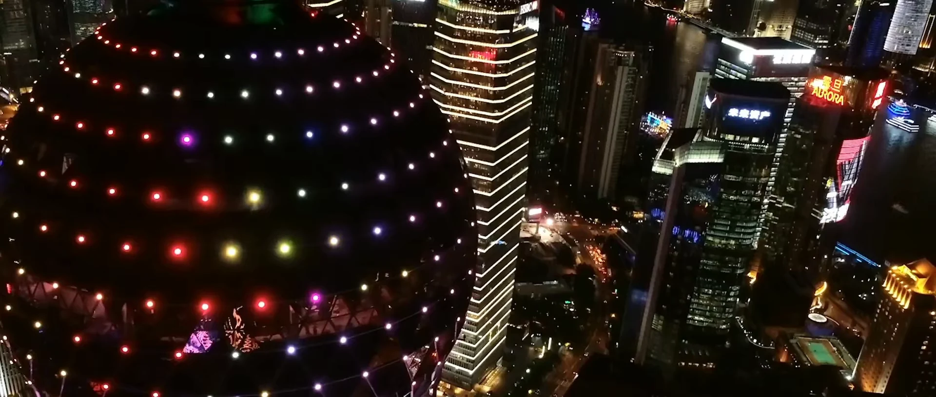 High-angle view of multicolored lights and surrounding city streets.