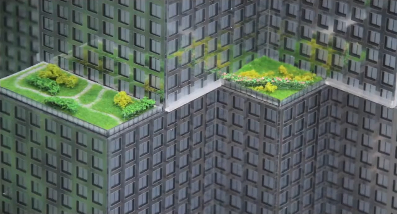 A tower model with planted terraces. An architectural proposal shown in the film.