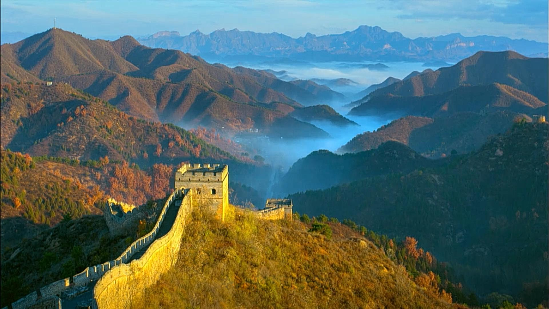The Great Wall following a mountain ridge above low cloud. Frame from the programme.