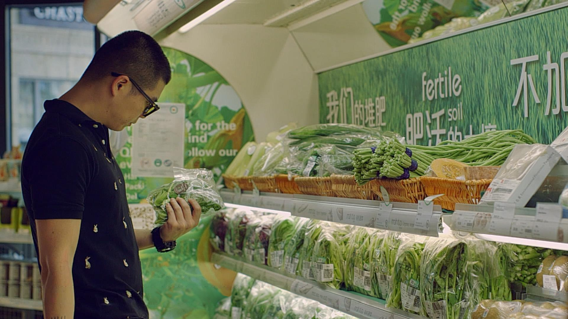 Choosing produce in the shop. Film still.