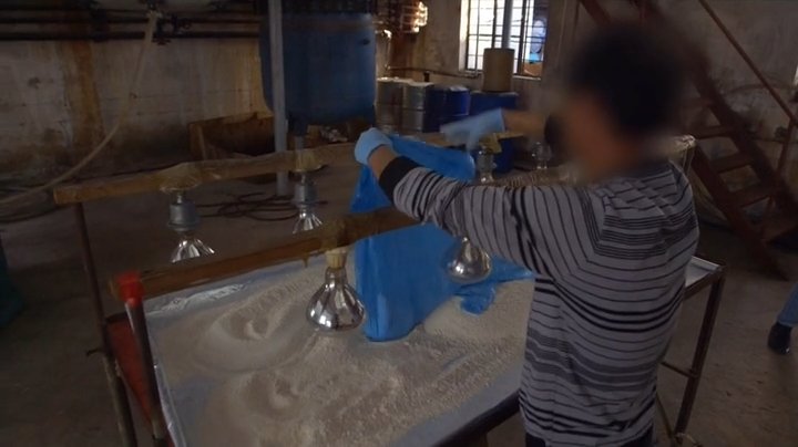 A workshop interior from the report. Episode still.