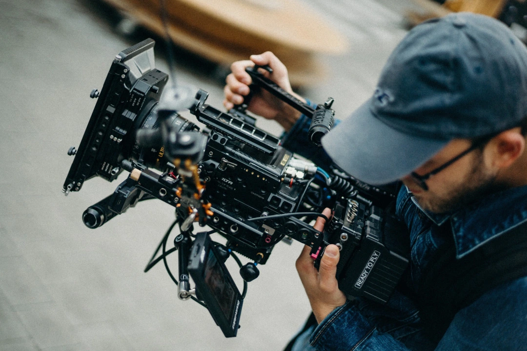 man with film camera