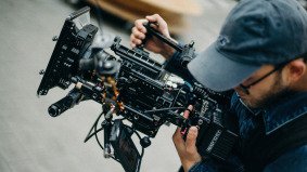 man with film camera