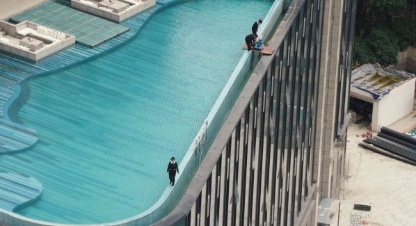 cleaning ladies thats working on the roof top swimming pool