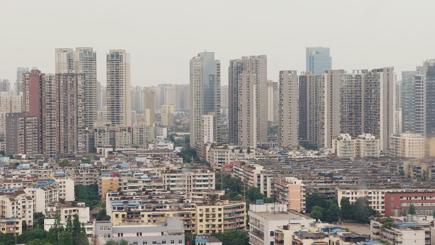 Residential towers and lower buildings in a dense cityscape.