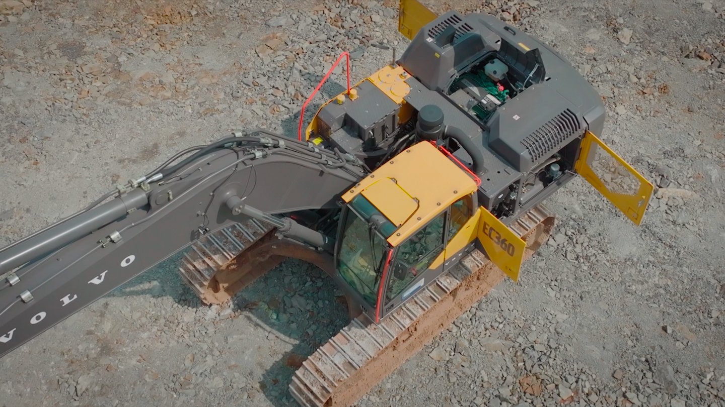 High-angle view of a Volvo EC360 excavator on the limestone mine floor