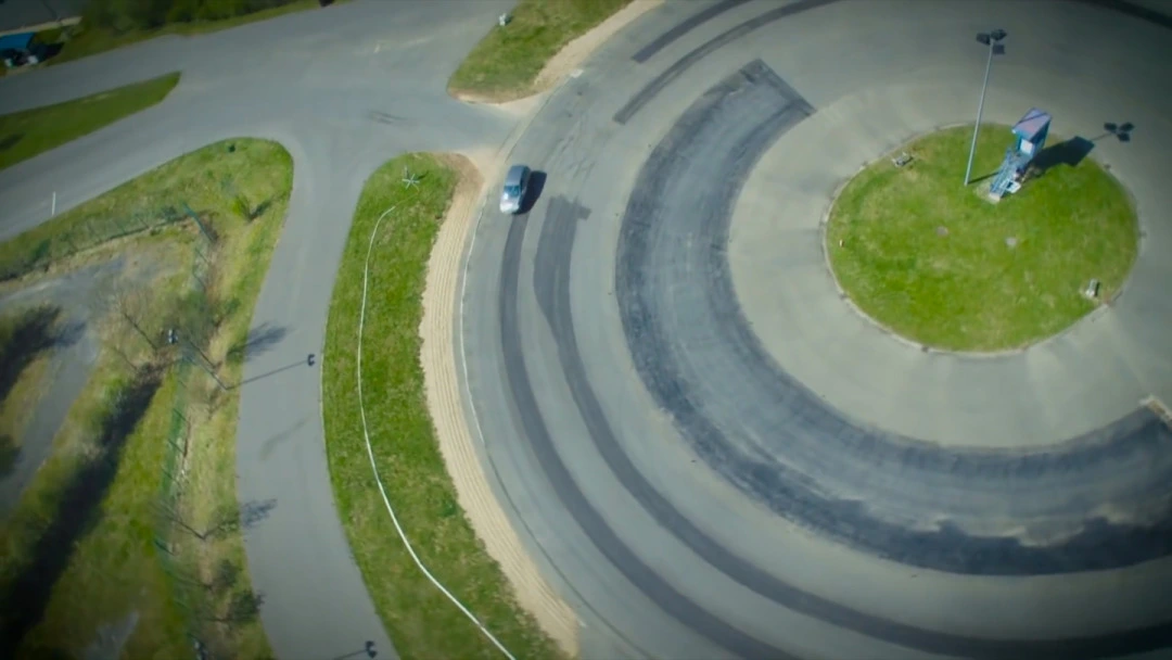 Aerial view of a circular vehicle test track used in the TRW campaign