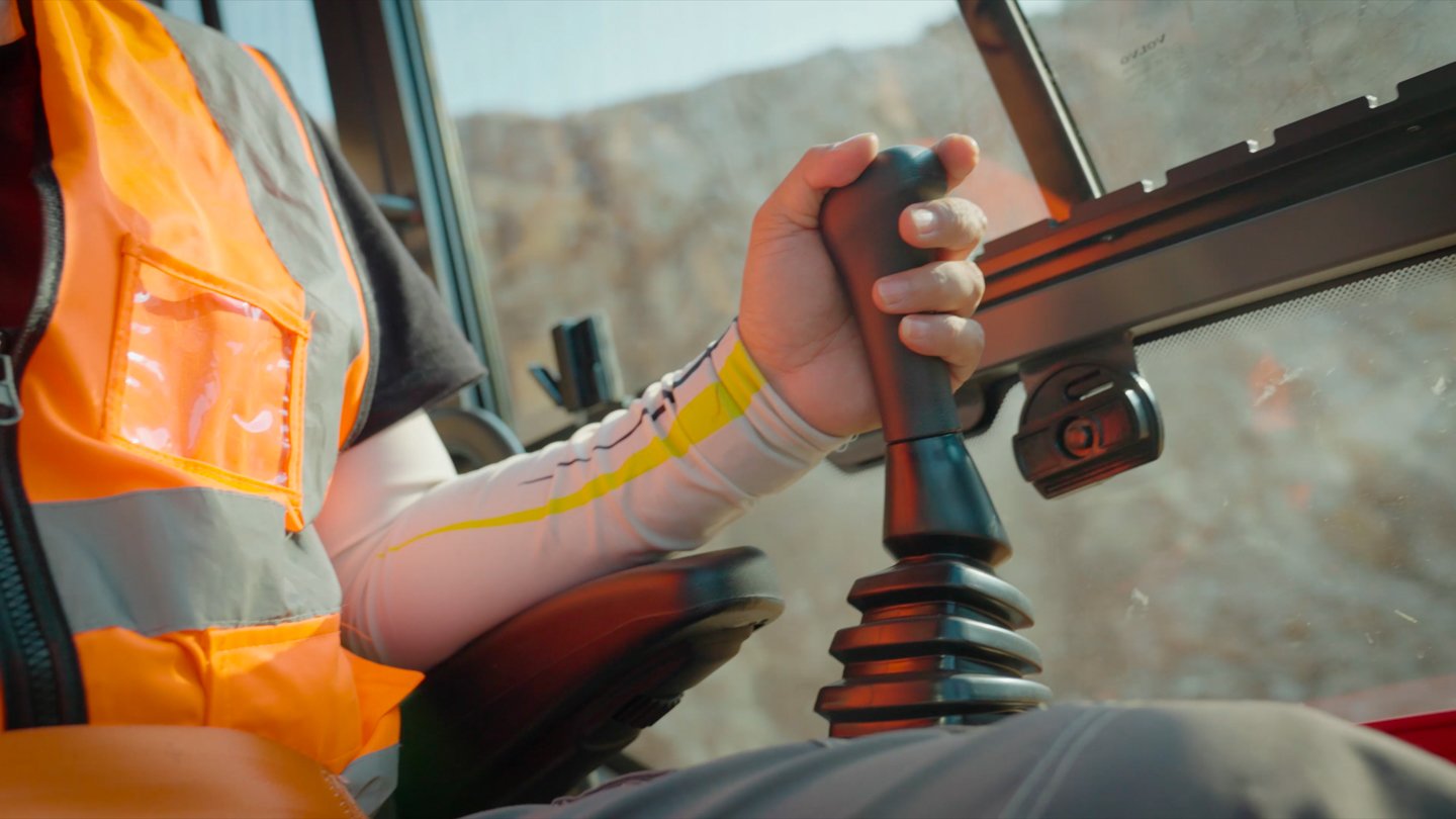 Close-up of the Volvo EC360 joystick and operator control console