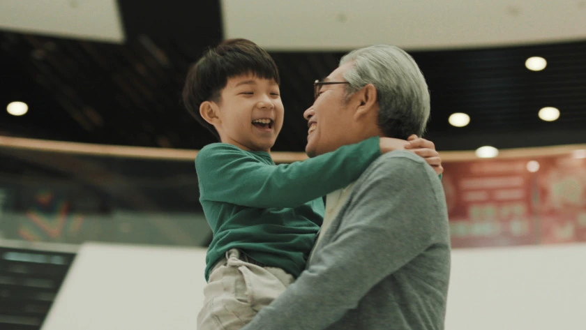 father carrying son