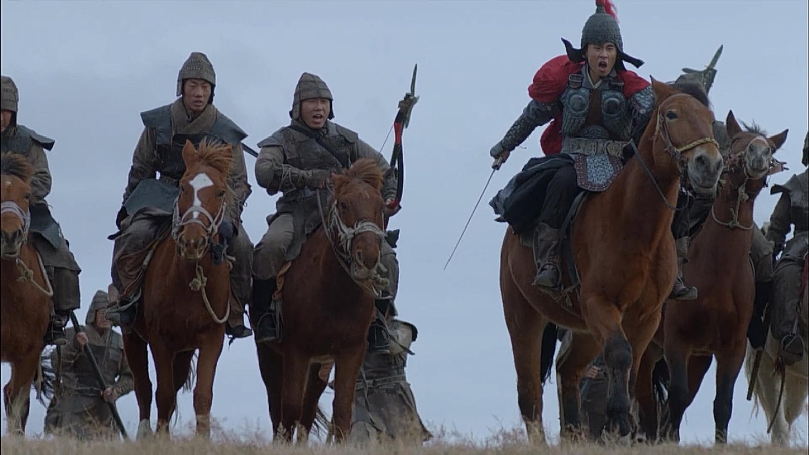 A closer view of mounted soldiers in a historical re-enactment.