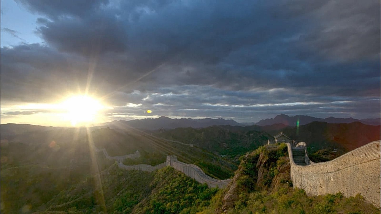Sunlight breaking over the wall’s mountain setting.
