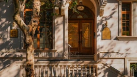 A cyclist passes by a historic building in Shanghai's French Concession, an area rich in heritage and cinematic appeal.