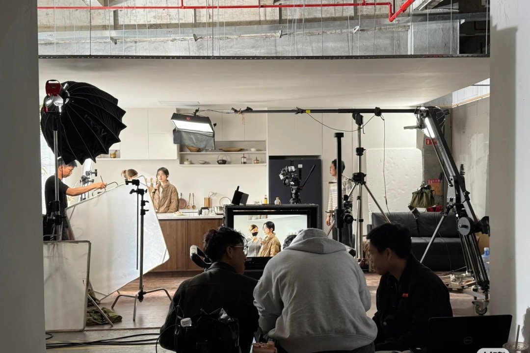 Image illustrating the process of hiring cast and crew for film production in China, featuring a diverse team working on set.