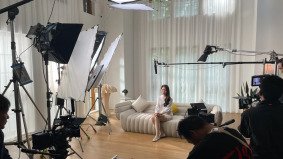 A behind-the-scenes look at a Chinese film crew coordinating a production in a culturally rich location.