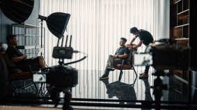 Indoor film production set in Shanghai with lighting and equipment in use.