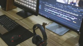 A desktop video editing setup used for sourcing and licensing footage in China