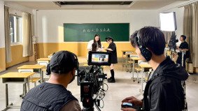 Behind the scenes of a classroom scene video shoot
