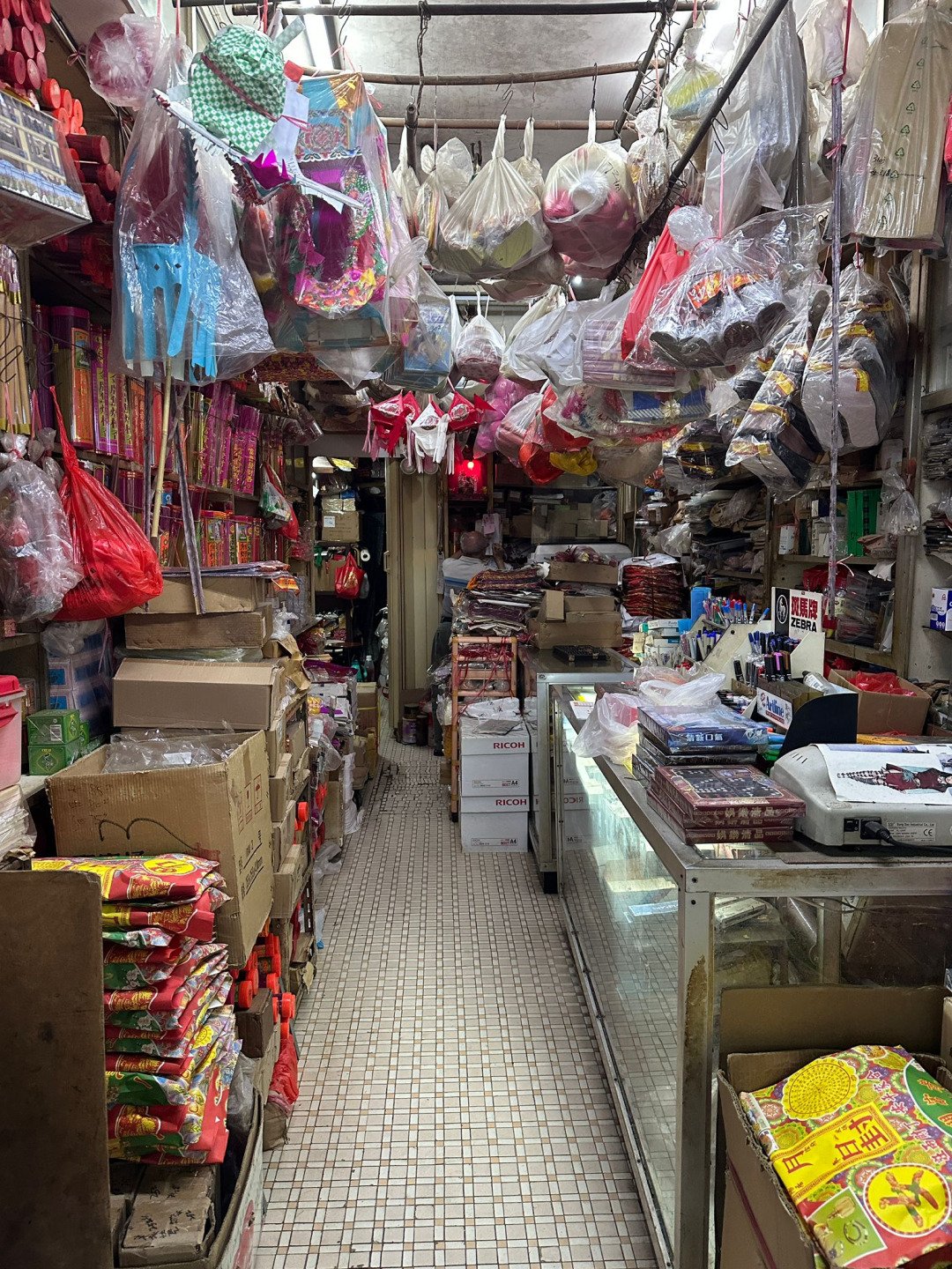 Interior of traditional joss paper shop in Monster Building – local character for cultural film projects