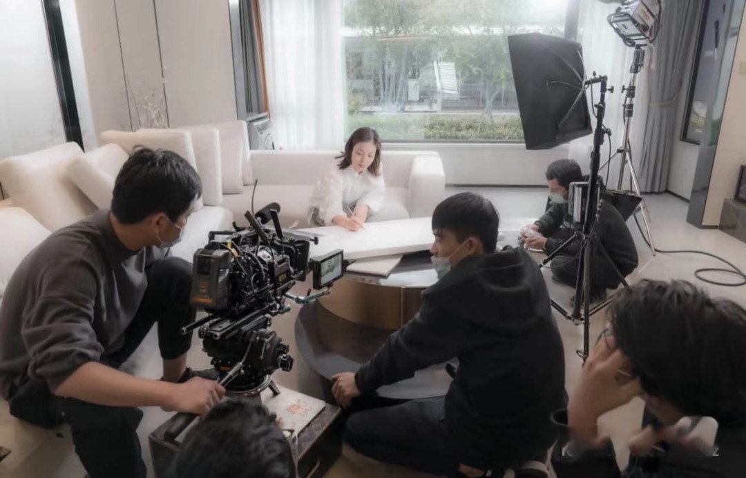 Video shooting fixer China filming a woman on a sofa in a home setting