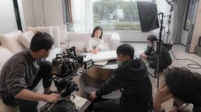 Video shooting fixer China filming a woman on a sofa in a home setting