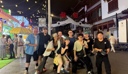 Group picture of Alchemist Films crew and New Zealand clients in Uganda and Shanghai, showcasing strong international production partnerships