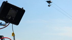 Flying cat camera rig over Akima stage at VAC Festival in China — supported by Alchemist Films video production fixer services