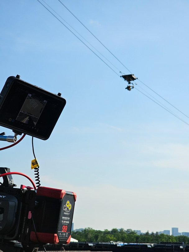 Flying cat camera rig over Akima stage at VAC Festival in China — supported by Alchemist Films video production fixer services