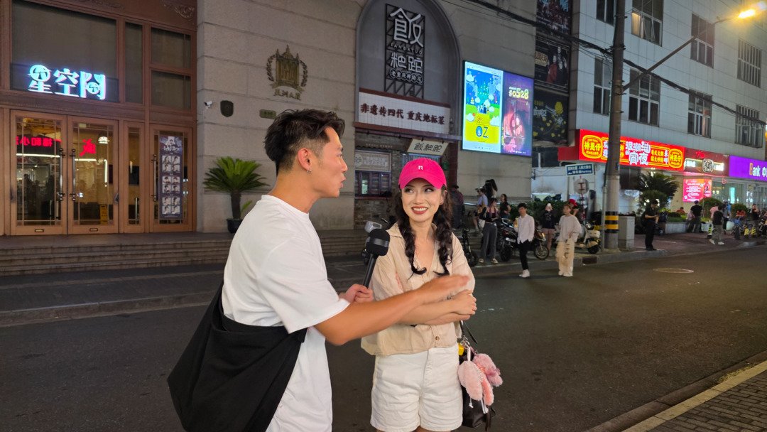 Host interviewing a renowned music theatre actor outside a Shanghai theatre after the show — video production fixer and support by Alchemist Films
