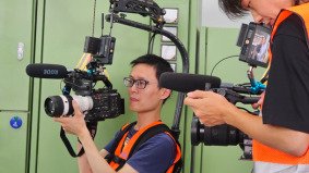 Two local Chinese Directors of Photography shooting content in a Shanghai factory for an international collaboration — supported by Alchemist Films’ China fixer video production services