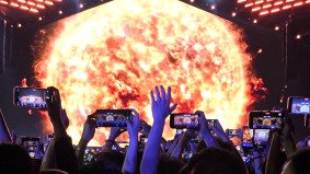 Huge glowing sun graphic on LED screen during VAC Festival, captured by Alchemist Films live event production team in China