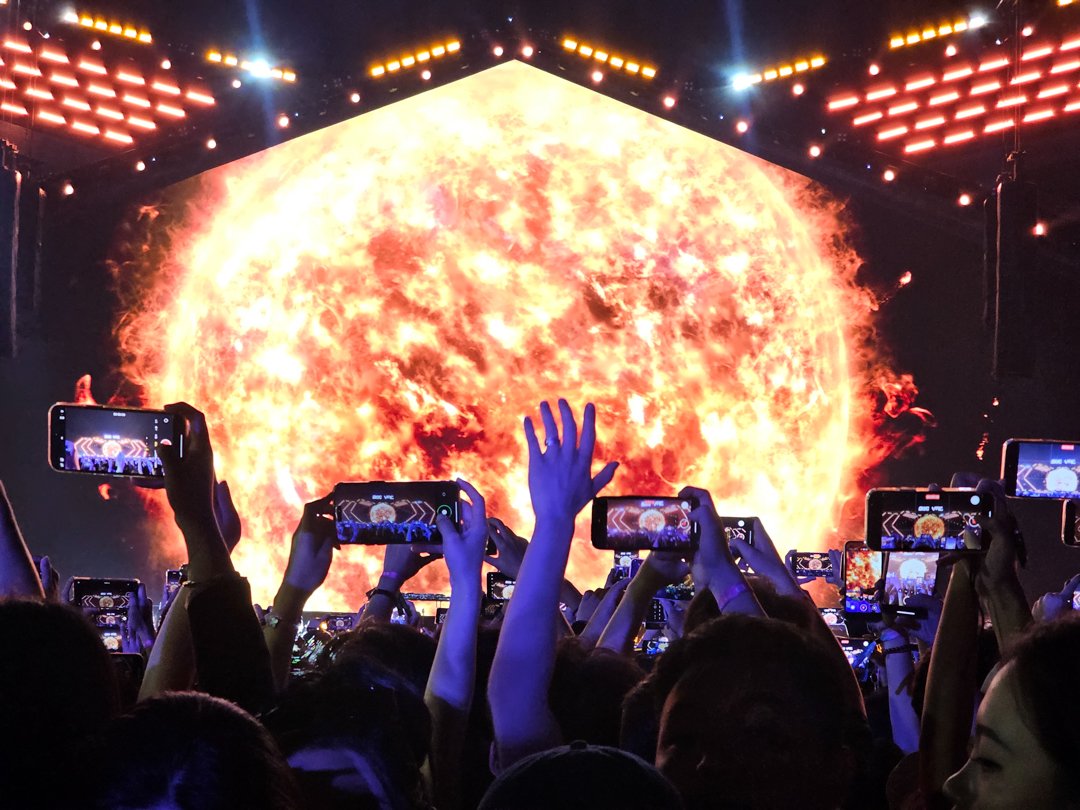 Huge glowing sun graphic on LED screen during VAC Festival, captured by Alchemist Films live event production team in China